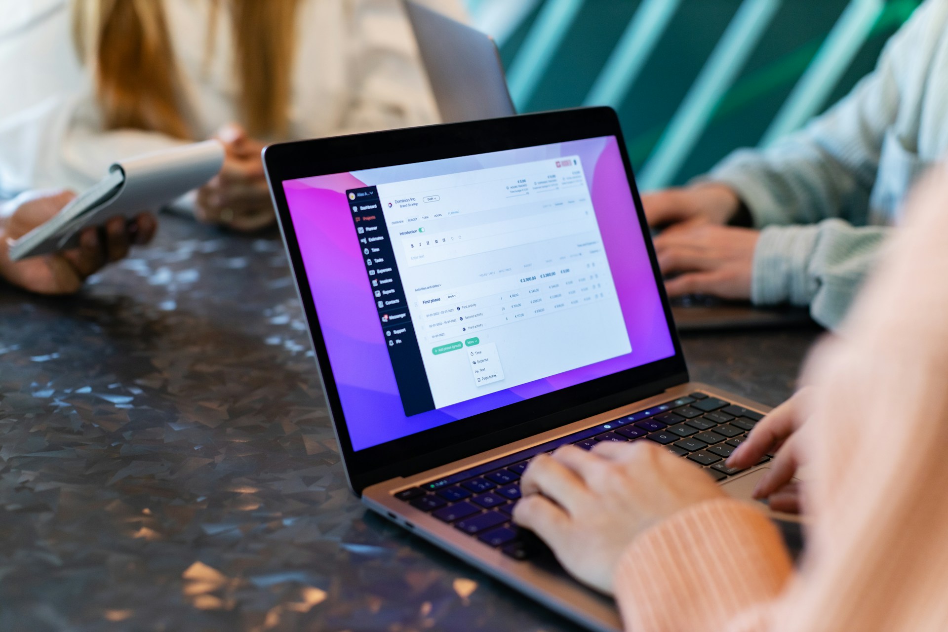 Team member working on a digital marketing strategy using a laptop